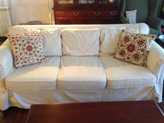 the couch with the slipcover and suzani from our favorite Uzbek artisan in Tashkent